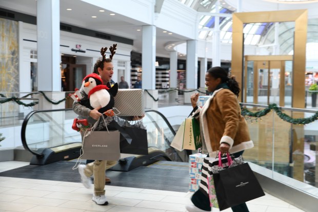 This photo was taken during filming of a commercial that is part of the Valley Forge Tourism and Convention Board's most recent marketing campaign. In this photo, the actors, portraying a family visiting the county, do some shopping at King of Prussia Mall. (Photo Courtesy Valley Forge Tourism and Convention Board)